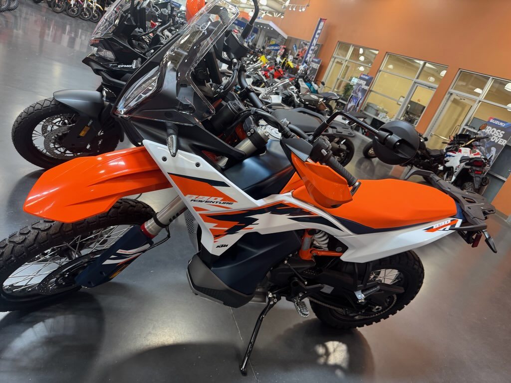 KTM 890 Adventure R with knobby tires and orange handguards